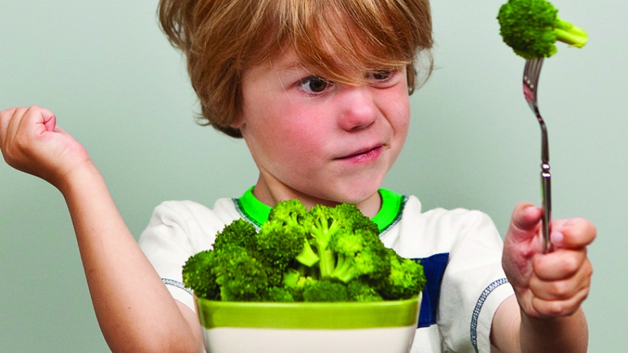 kid with a bowl of broccoli